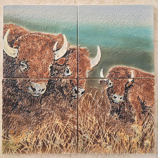 This is a front view of a mural of 4 handmade tiles showing 3 American Bison. 
These tiles are handmade porcelain ceramic tiles that could be installed as kitchen wall tiles, kitchen backsplash tiles. 
This image is intended to remind us of our connection to nature.