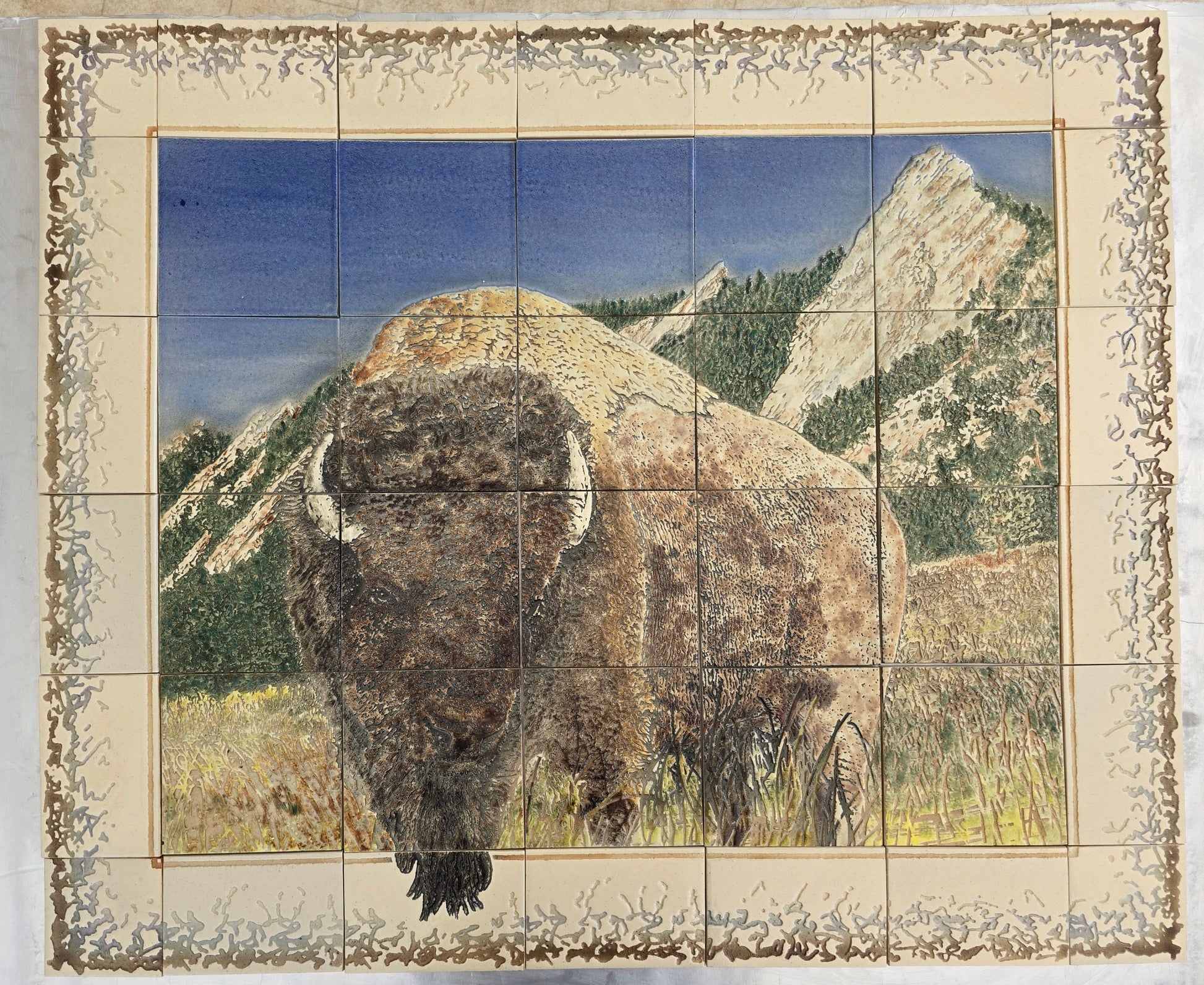 This Buffalo (properly called American Bison) is a set of 42 porcelain tiles with a Chitaqua park background. Each of the tiles is about 5/16" thick. These tiles can be mounted indoors or outdoors on wall or floor.