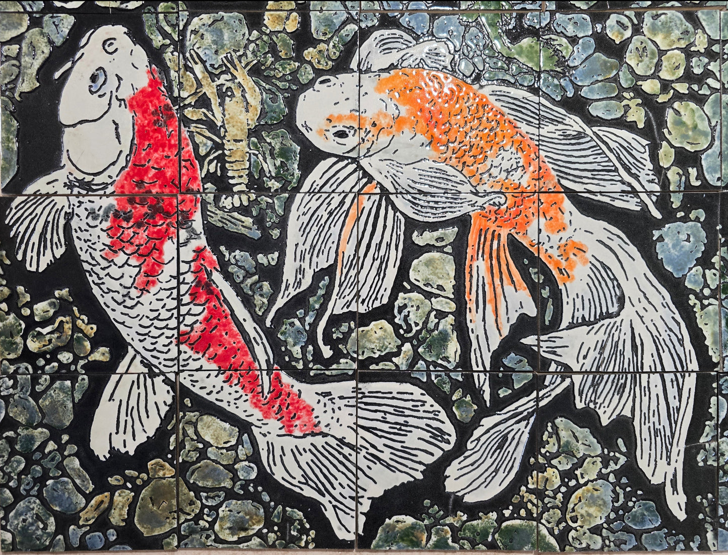 This is a top view of the lower left quadrant of Koi Fish #1 tile mural set. This view is provided to show the detail of the coloring of the fish and to show the crayfish on the pool floor that spans 2 of the tiles in the upper left of this quadrant. Also, at the upper right center tile there is part of small fish that  is continued in the upper left quadrant set.